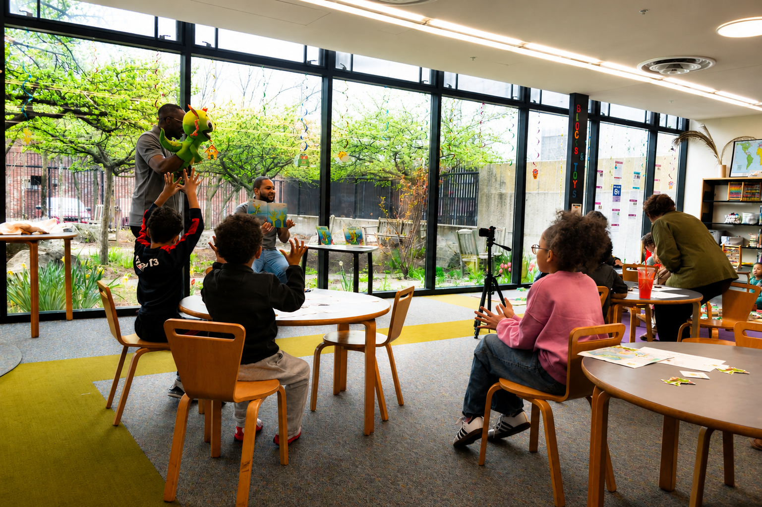 Children actively participating and engaged during a STEMtacular storytime session